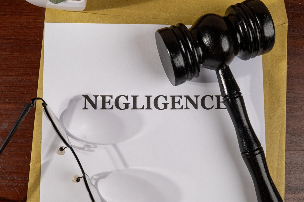 Negligence Title on Legal Documents Set on Desk – Legal Concept